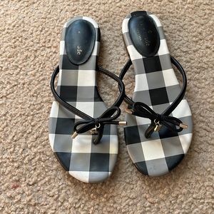 Kate Spade bow
1/4" heel
Round-toe slip-on flip-flop sandals
Bow detail at strap